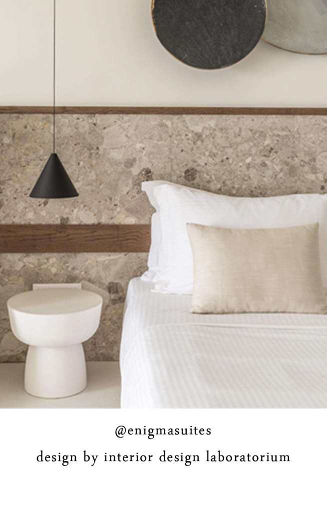 instagram image of ENIGMA SUITES SANTORINI design by INTERIOR DESIGN LABORATORIUM with ALENTES MUSHROOM SOLID table in white. furniture and accessories cast from stone, marble and cement designed and made by ALENTES in Greece.
