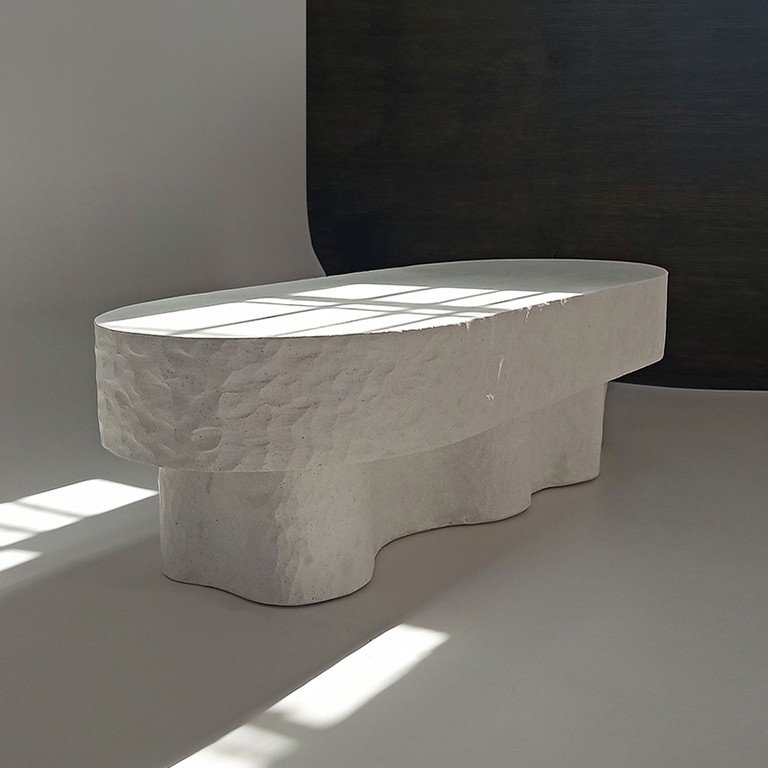 Medusa bench/table hand sculpted in white cast stone by Alentes Atelier.